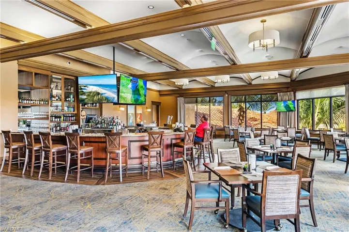 Dining area with plenty of natural light and a dry bar