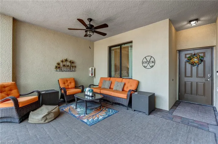 View of patio featuring an outdoor hangout area and a ceiling fan