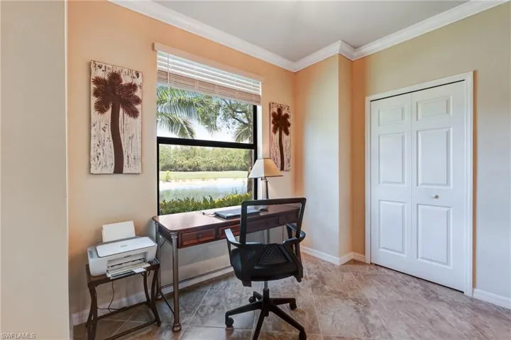 Office with ornamental molding and baseboards