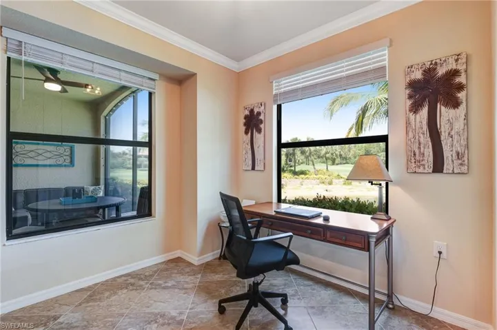 Home office featuring crown molding and baseboards