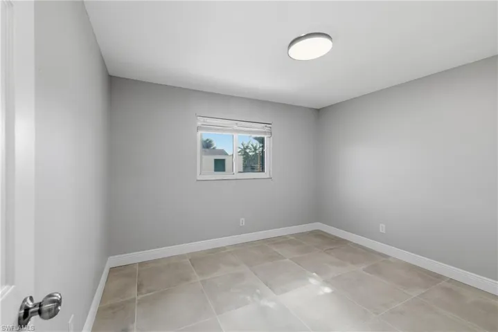 Empty room with baseboards