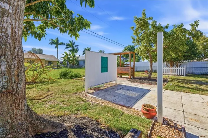 View of outdoor structure with a fenced backyard