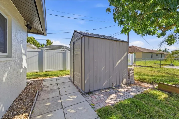 View of shed featuring a fenced backyard