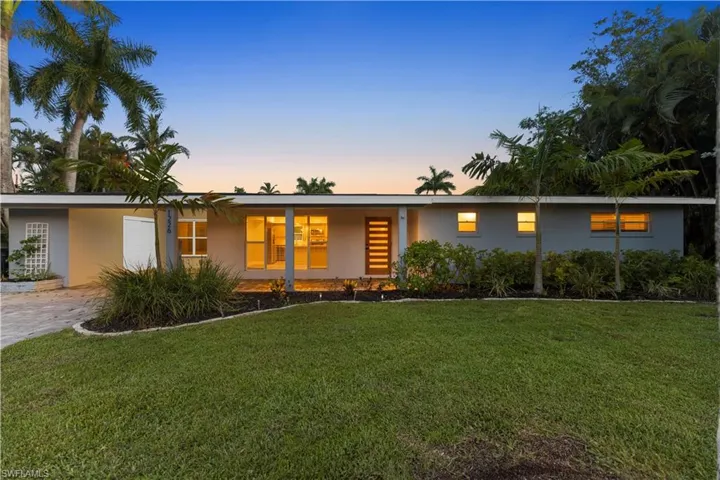 Ranch-style house with a yard