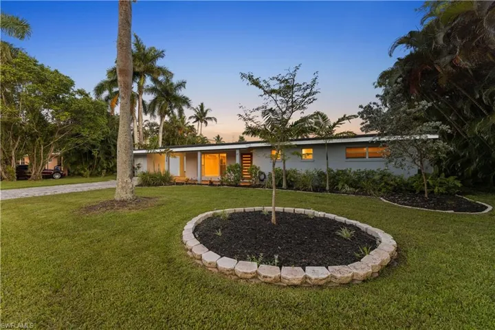 Ranch-style house featuring a yard