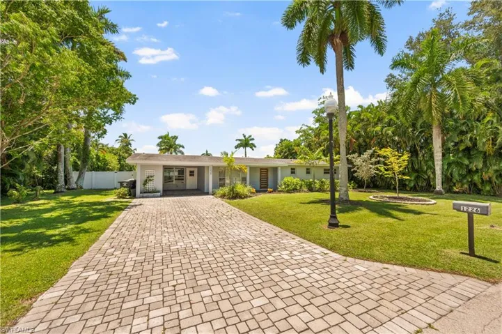 Single story home with a front lawn