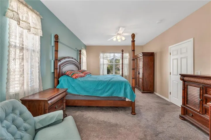 Primary Bedroom featuring carpet flooring and ceiling fan