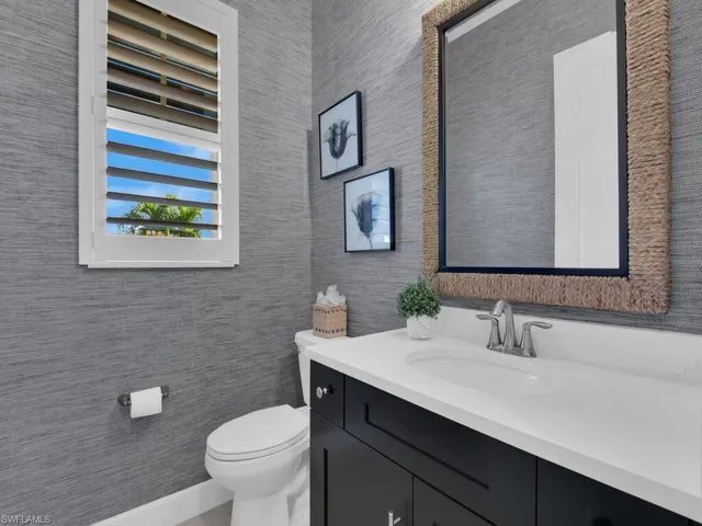 Powder Room - wallpaper and custom mirror to ceiling