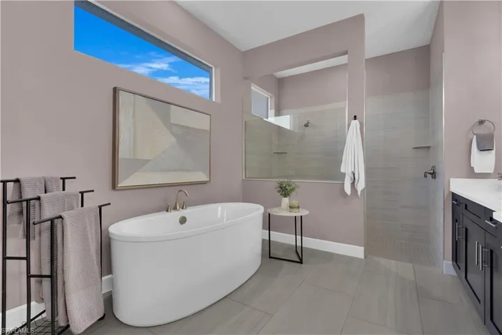 Master Bath - Quartz counters, dual sinks, soft closing drawers, makeup vanity, & private water closet.