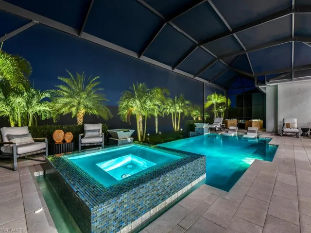 Stunning Outdoor Living Space - Gas heated saltwater pool & spill-over spa, sun shelf, multiple water features & picture window screening