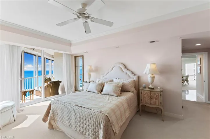 Primary bedroom with balcony access