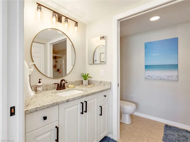 Primary En-Suite Vanity Area and Toilet Closet