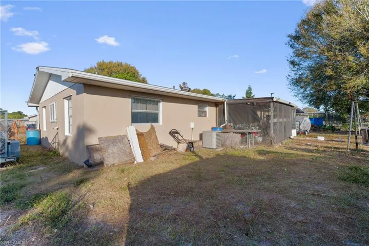 Back of property with stucco siding