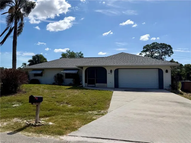 Single-story home featuring a gray shingle roof, attached garage, and a screened entry