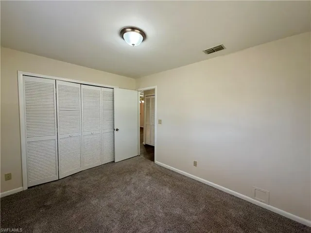 Wall-to-wall carpeting and neutral wall paint