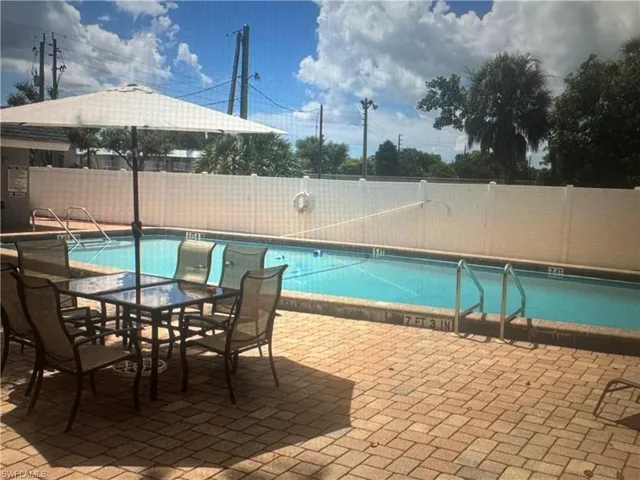 Community pool featuring a patio area