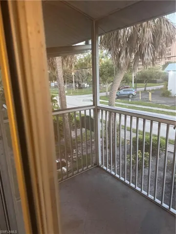 Balcony featuring a sunroom