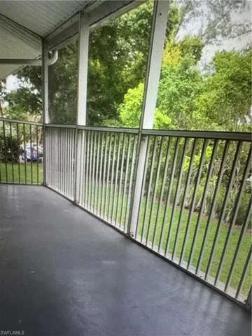 Balcony featuring a sunroom