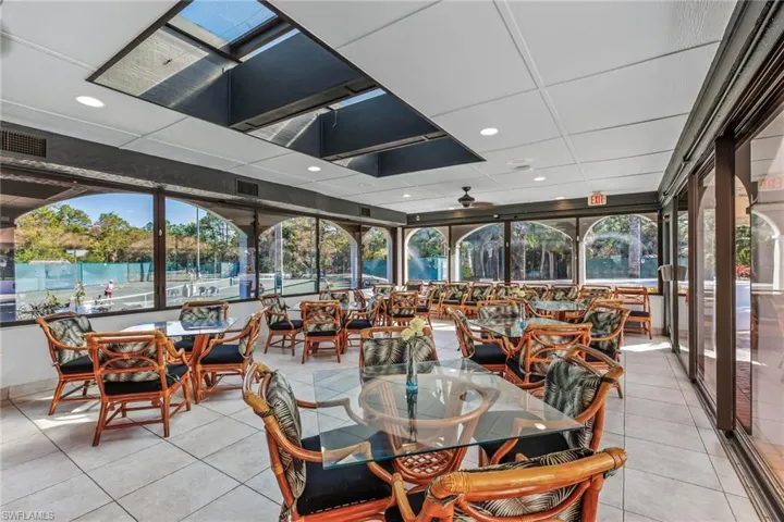 Sunroom / solarium featuring ceiling fan and a healthy amount of sunlight