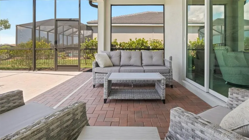 Sunroom / solarium featuring an outdoor lounge area and a patio area