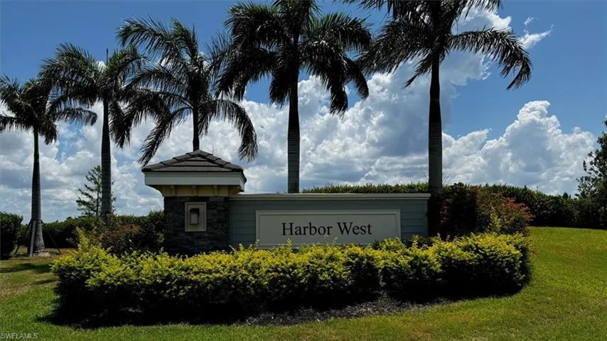 Community sign featuring a lawn