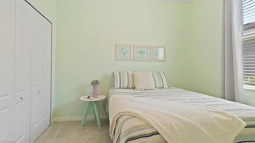 Bedroom with carpet flooring and a closet