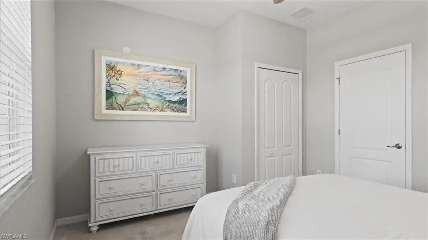 Bedroom with carpet flooring and a ceiling fan