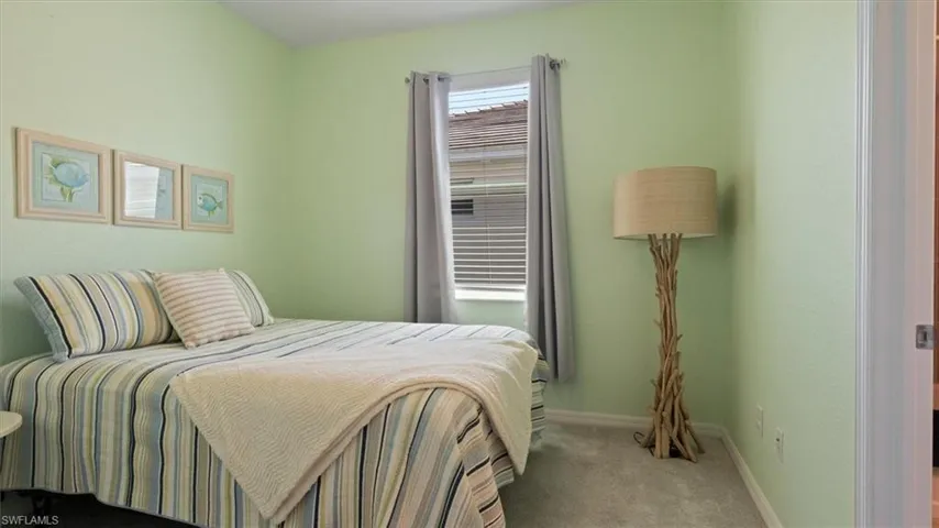 Bedroom with carpet and baseboards