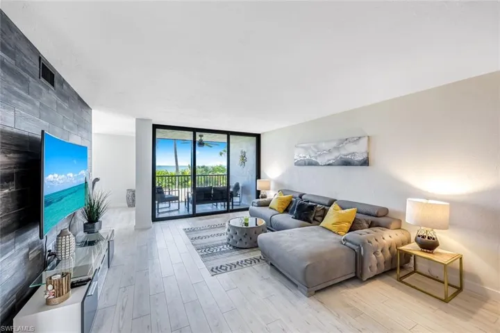 Living room featuring expansive windows and light wood-type flooring