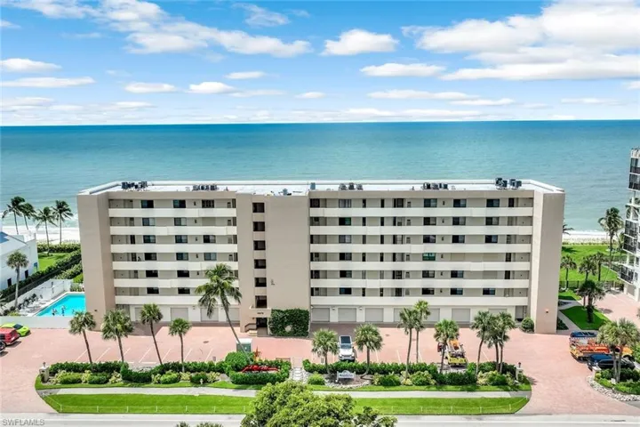 View of apartment building / complex featuring a water view