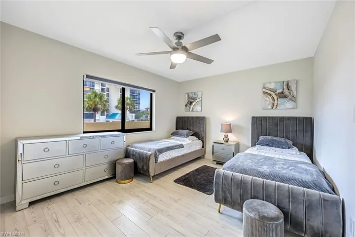 Bedroom with wood finished floors and ceiling fan
