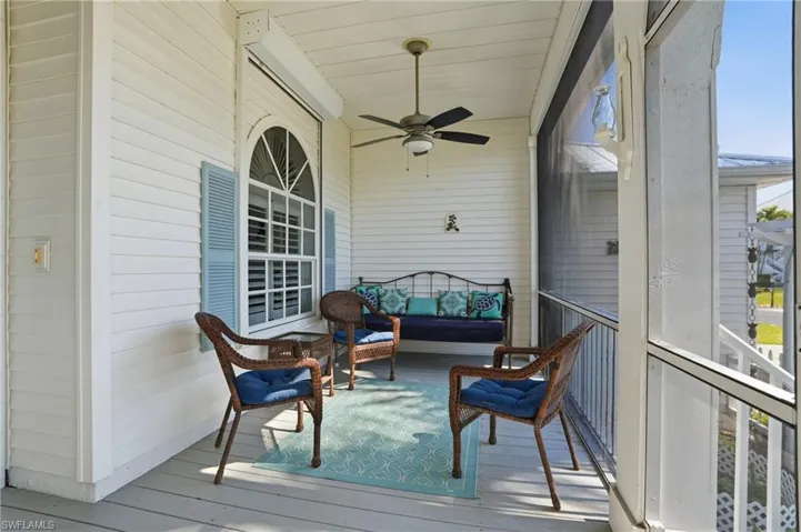 Sunroom / solarium with a ceiling fan and an outdoor hangout area