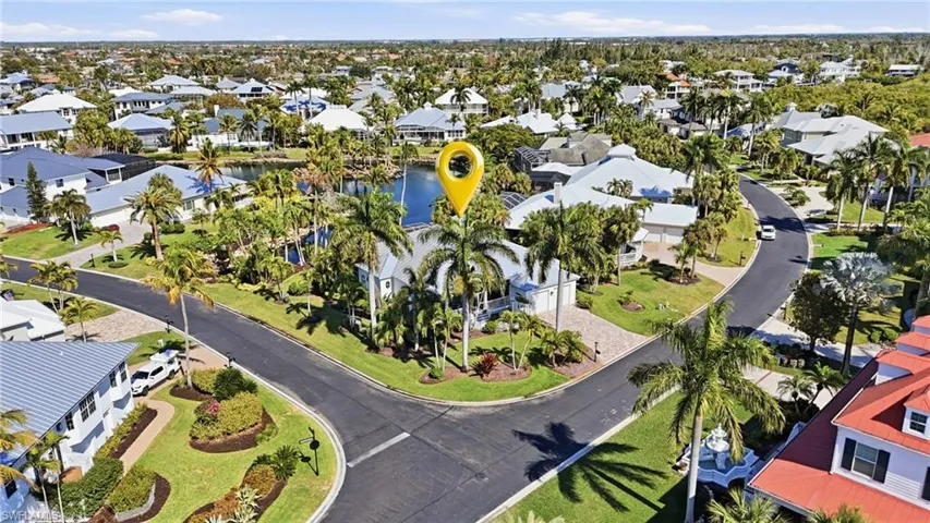Aerial perspective of suburban area with a large body of water