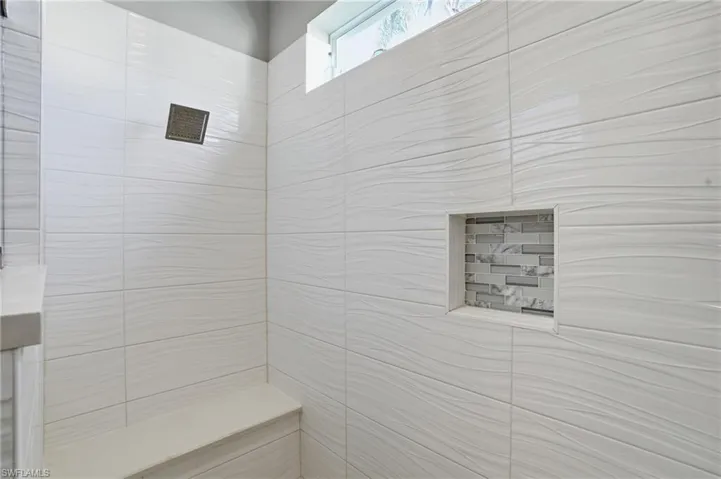 Bathroom with tiled shower