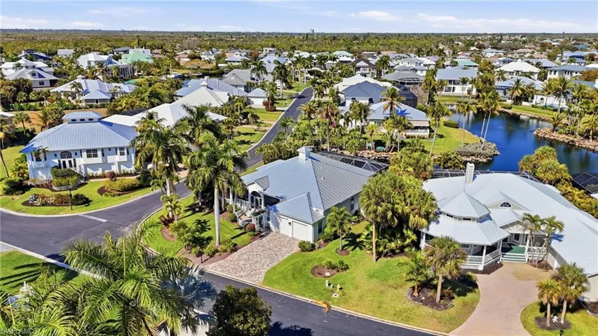 Aerial perspective of suburban area with a nearby body of water