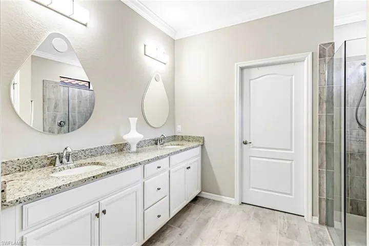 Primary BathDuel sinks and large shower