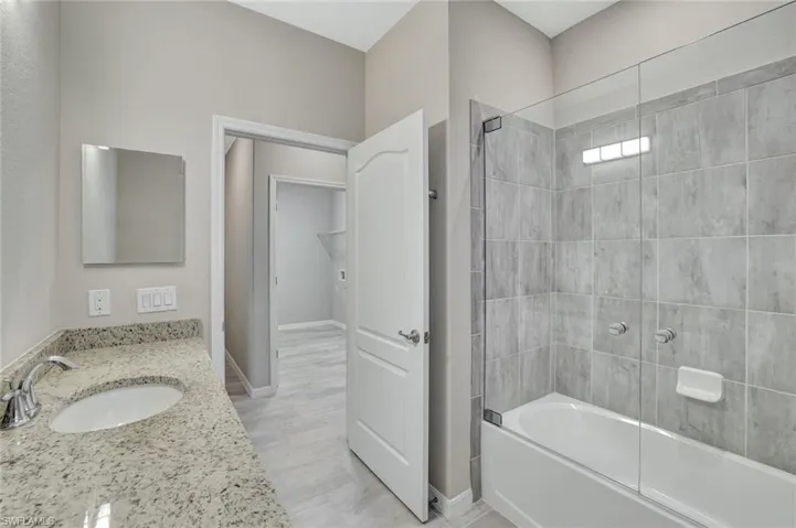 Guest Bath with custom glass tub enclosure