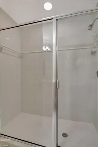 Bathroom with a shower with shower door
