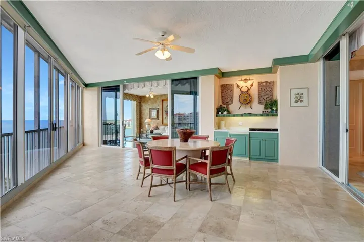 Dining room featuring ceiling fan and a textured ceiling