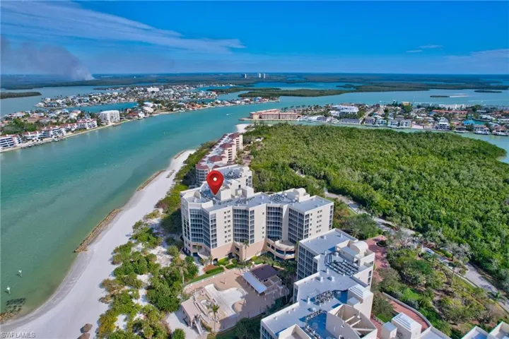 Drone / aerial view with a beach view and a water view