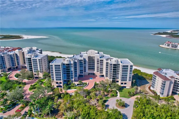 Drone / aerial view featuring a water view and a view of the beach