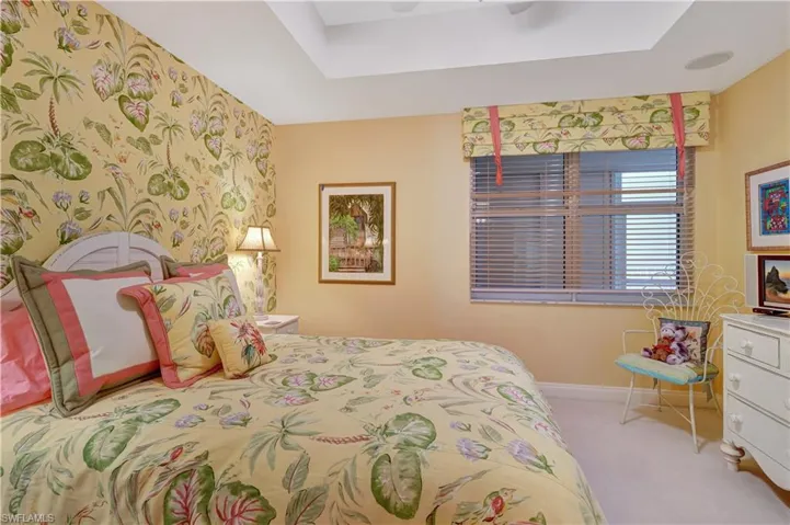 Bedroom featuring ceiling fan and light carpet