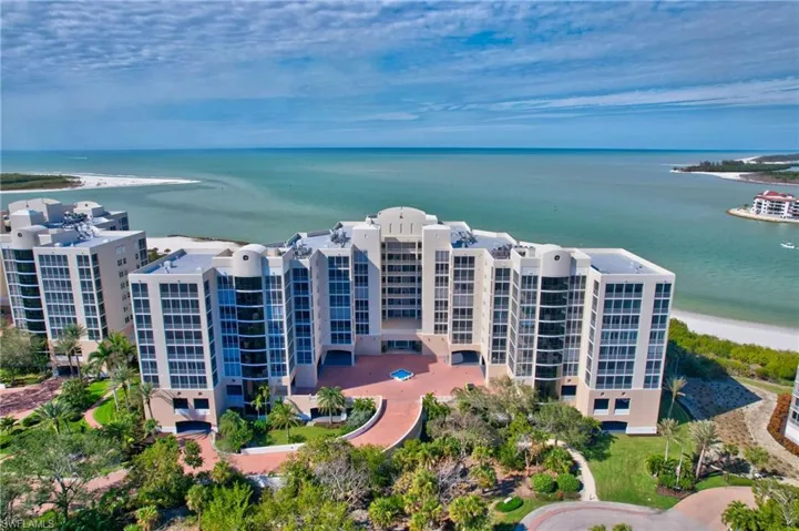 Bird's eye view with a water view and a beach view