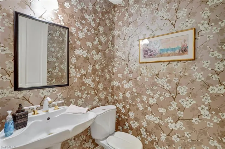 Bathroom featuring sink and toilet