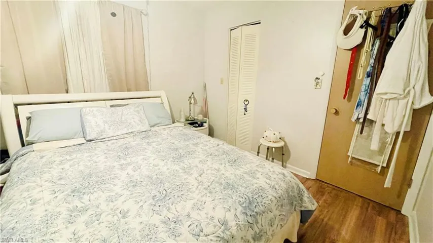 Bedroom with hardwood / wood-style floors