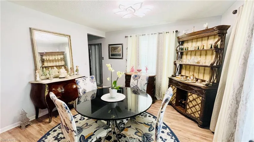 Dining room with light hardwood / wood-style floors