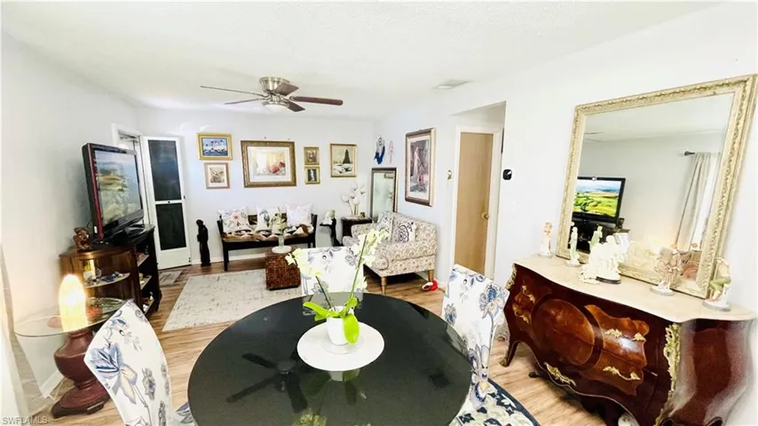 Dining area featuring ceiling fan and light wood-type flooring