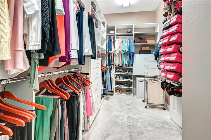 Spacious Owner's Closet with Custom Shelves