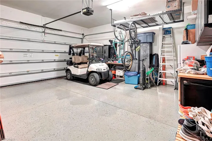 Garage featuring a garage door opener