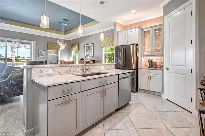 Kitchen with lighted cabinets and newer appliances
